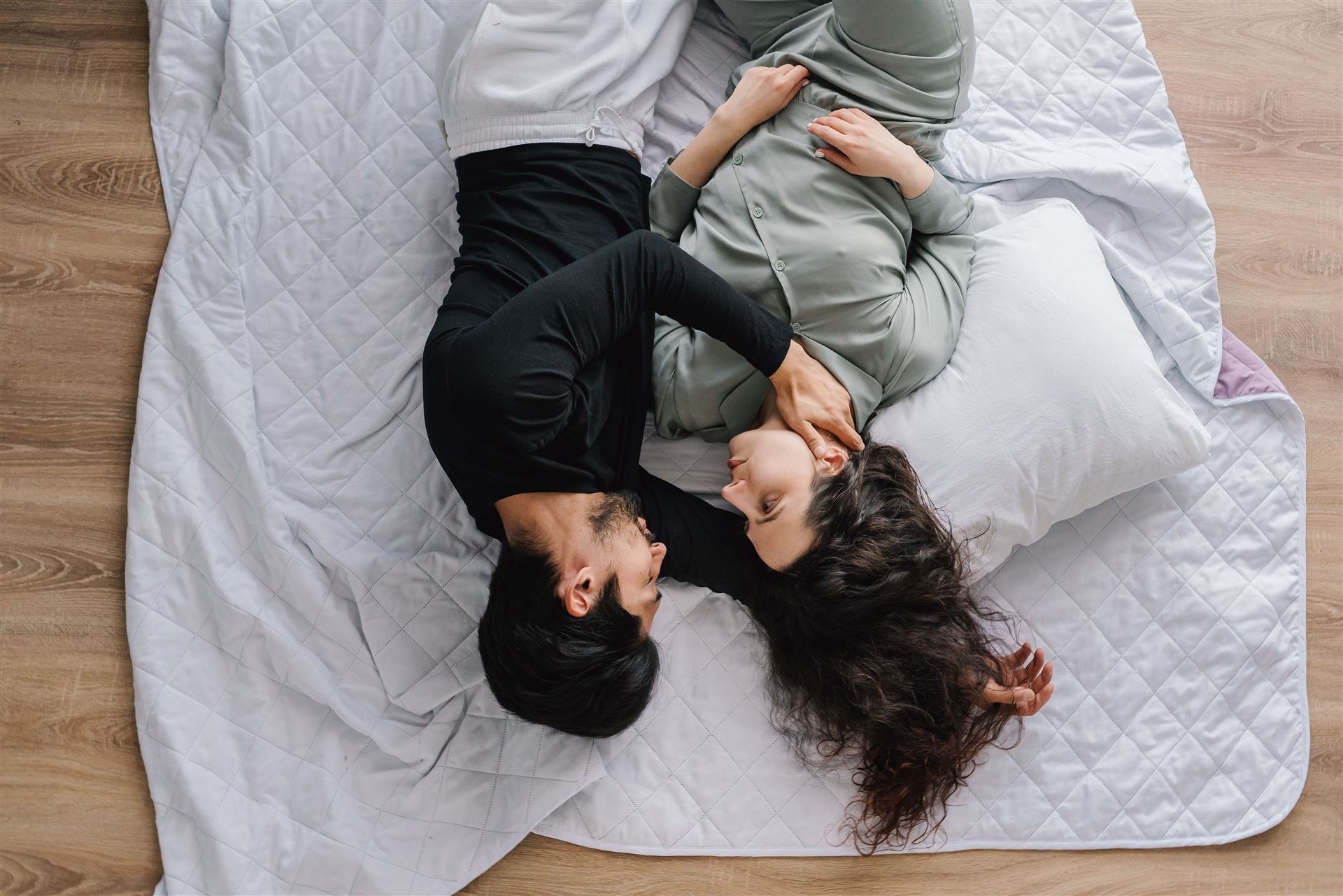 Couple relaxing on a comfortable bed